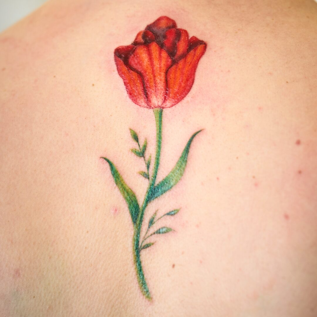Painterly style rose tattoo